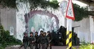 Presiden Taiwan Lai Ching-te mengenakan pelindung tubuh dan helm militer saat simulasi evakuasi darurat